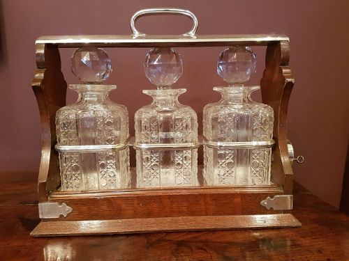 Antique Oak & Silvered Tilting Three Bottle Tantalus