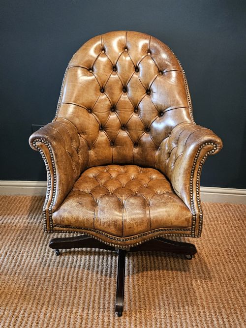 Deep Buttoned Leather Revolving and Rocking Chair