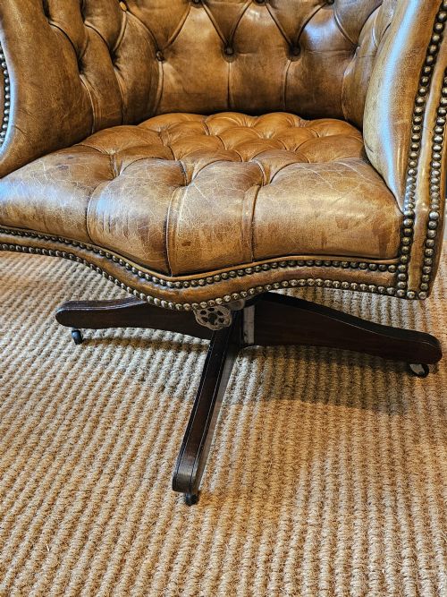 fig 1. Deep Buttoned Leather Revolving and Rocking Chair
