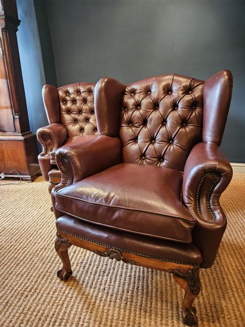 Pair of Carved Walnut Framed Leather Wing Back Arm Chairs