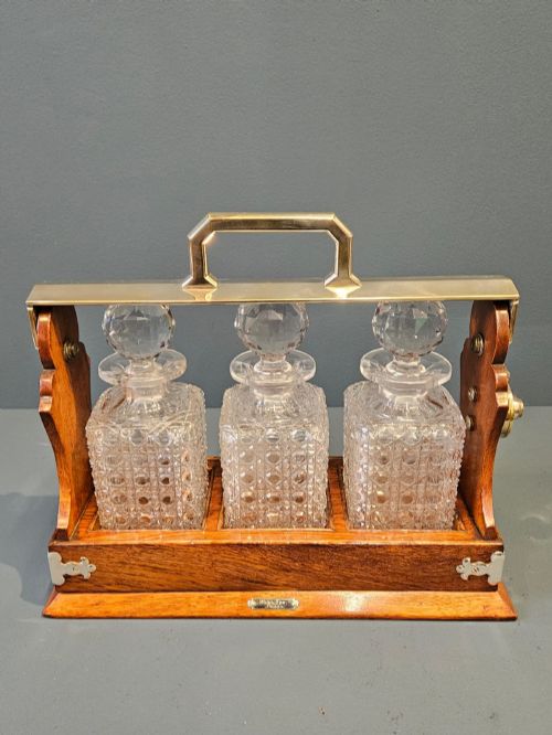 VICTORIAN OAK AND SILVER PLATED THREE BOTTLE TANTALUS - ADDITIONAL PHOTO 1