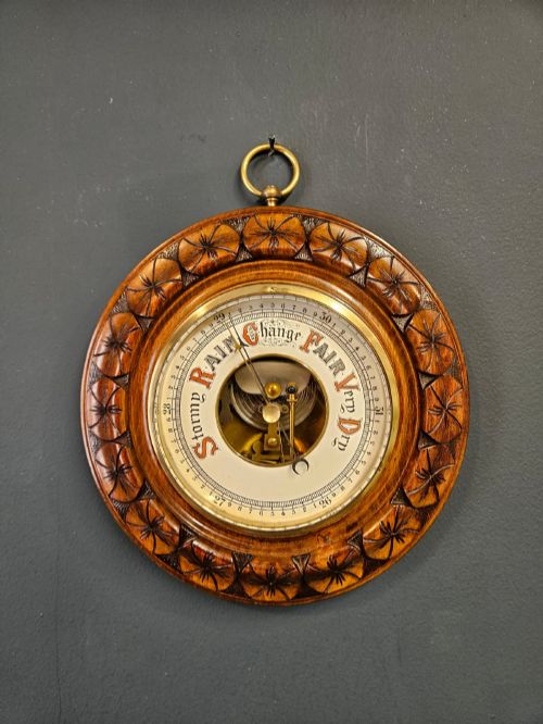 VICTORIAN WALNUT ANEROID BAROMETER WITH FLOWER HEAD BORDER