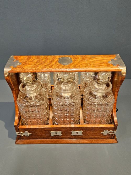 VICTORIAN OAK AND SILVER PLATED THREE BOTTLE TANTALUS - ADDITIONAL PHOTO 5