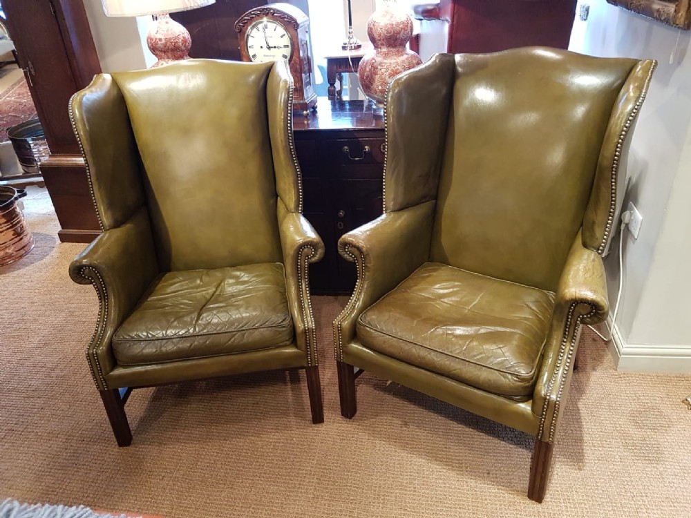 Pair Of Antique 1920's Olive Hide Wing Back Chairs