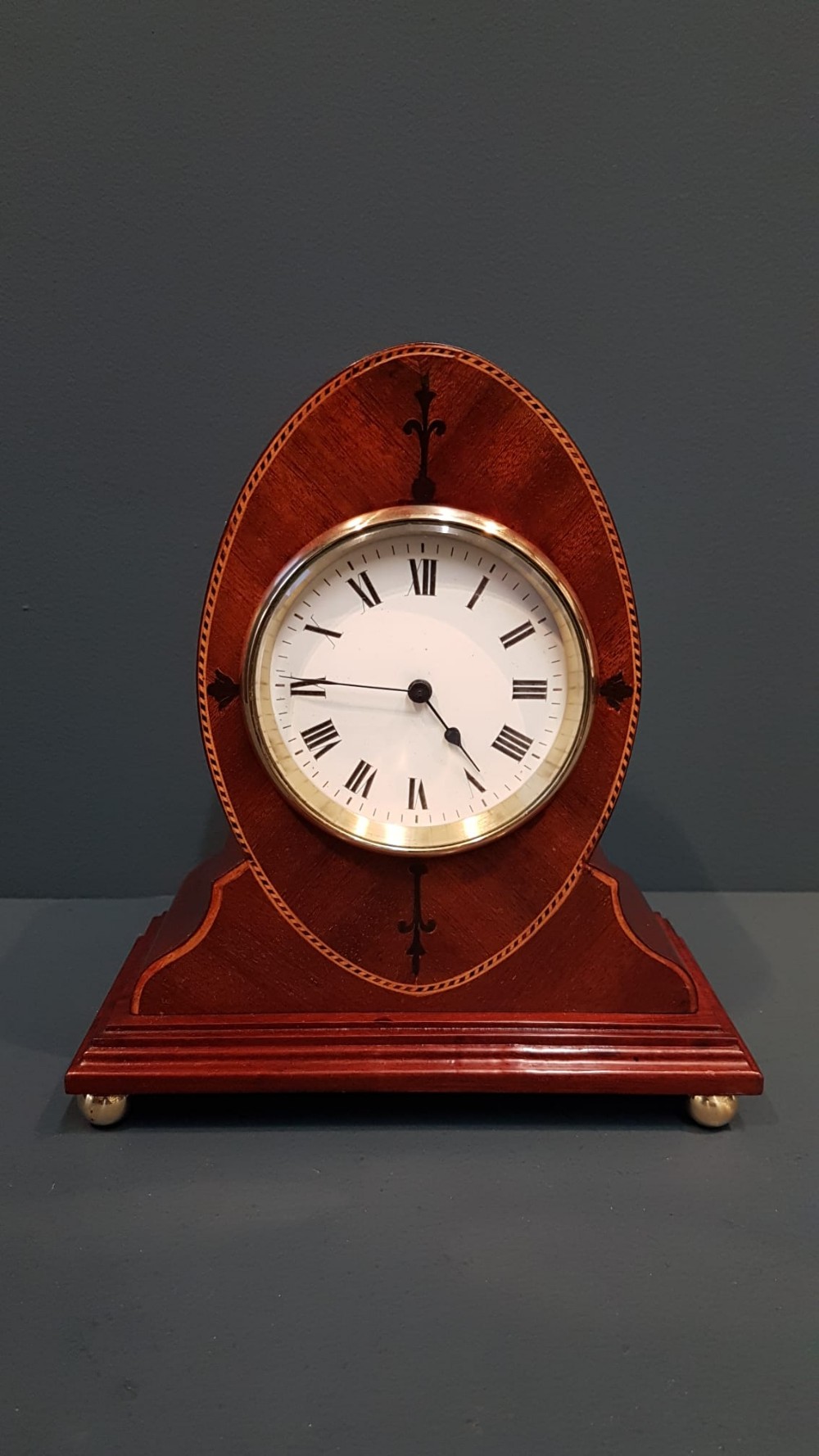 Fine Quality Elliptical Inlaid Mahogany Mantel Clock