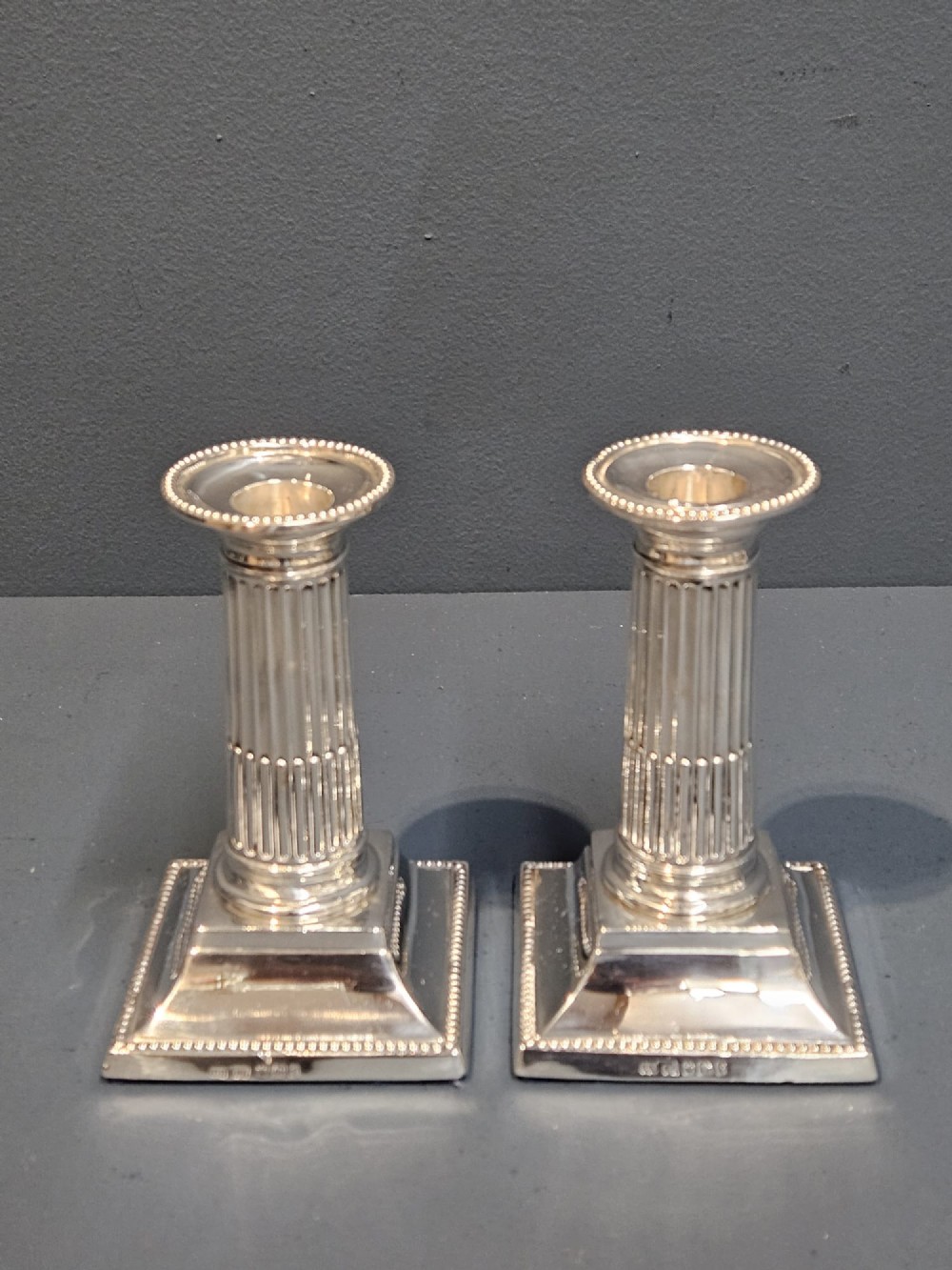 Pair of Victorian Silver Reeded Column Candlesticks