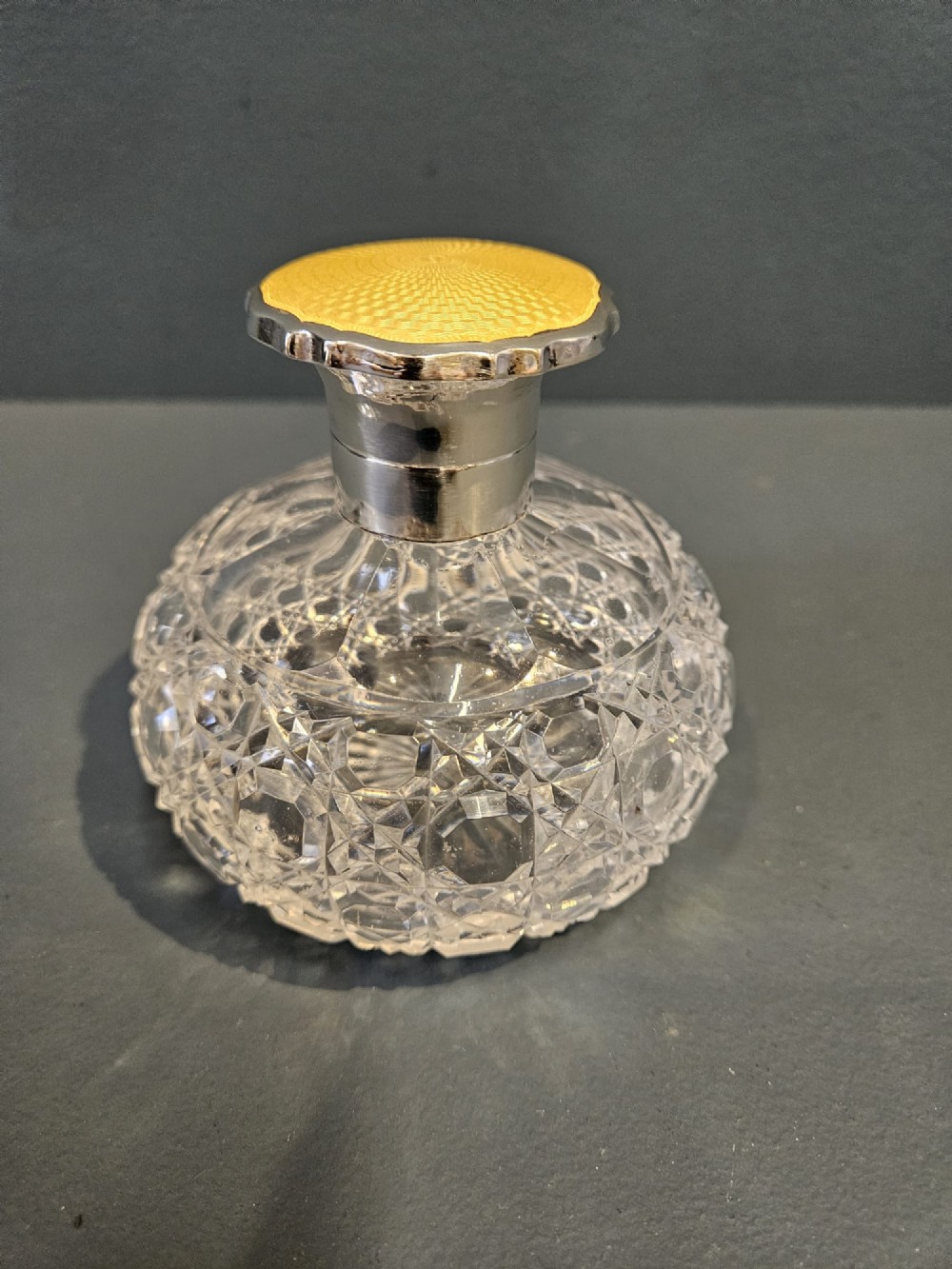 Silver and Yellow Engine Turned Enamel Topped Crystal Scent Bottle