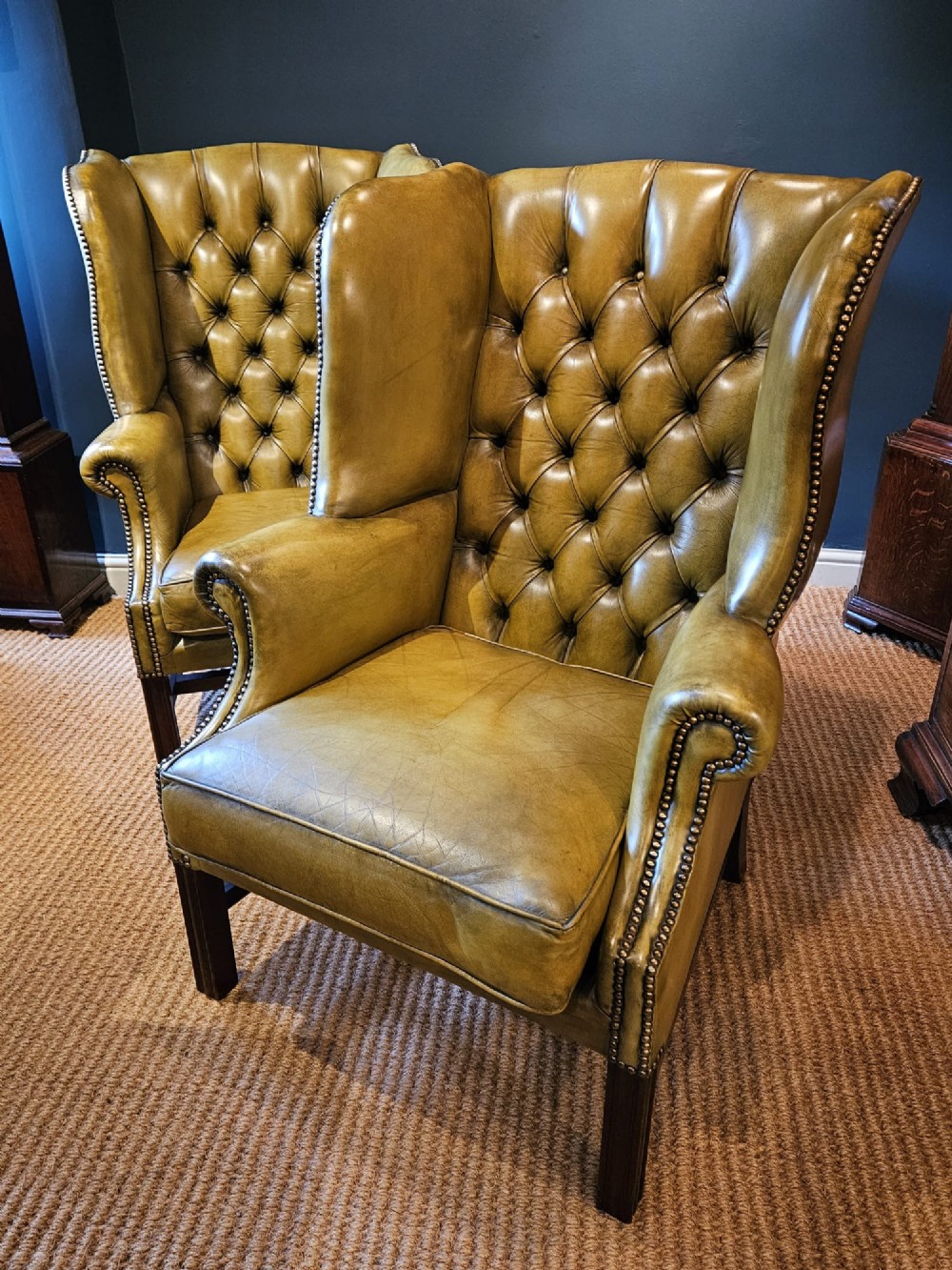 Matching Pair of Leather Wing Back Arm Chairs
