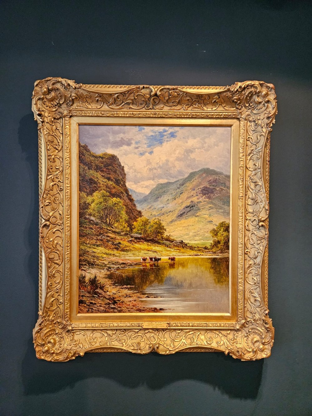 A Victorian landscape oil painting depicting cattle at the waters edge of Loch Etive in a sweeping gilt frame.