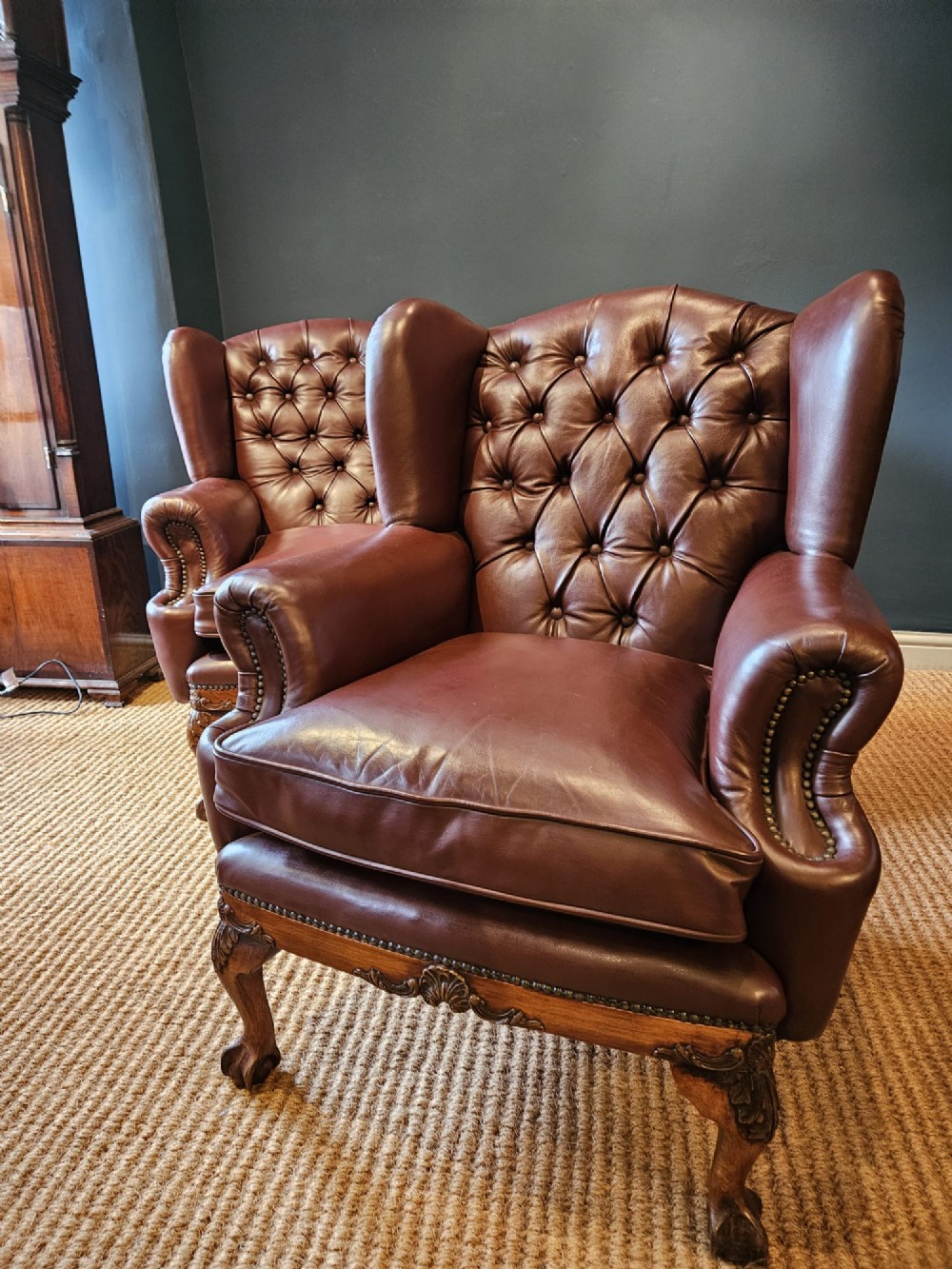 Pair of Carved Walnut Framed Leather Wing Back Arm Chairs