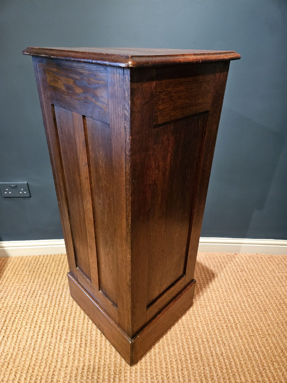 A tall Victorian medium brown oak filing cabinet featuring internal document trays with brass label holders and a top key lock. View VI