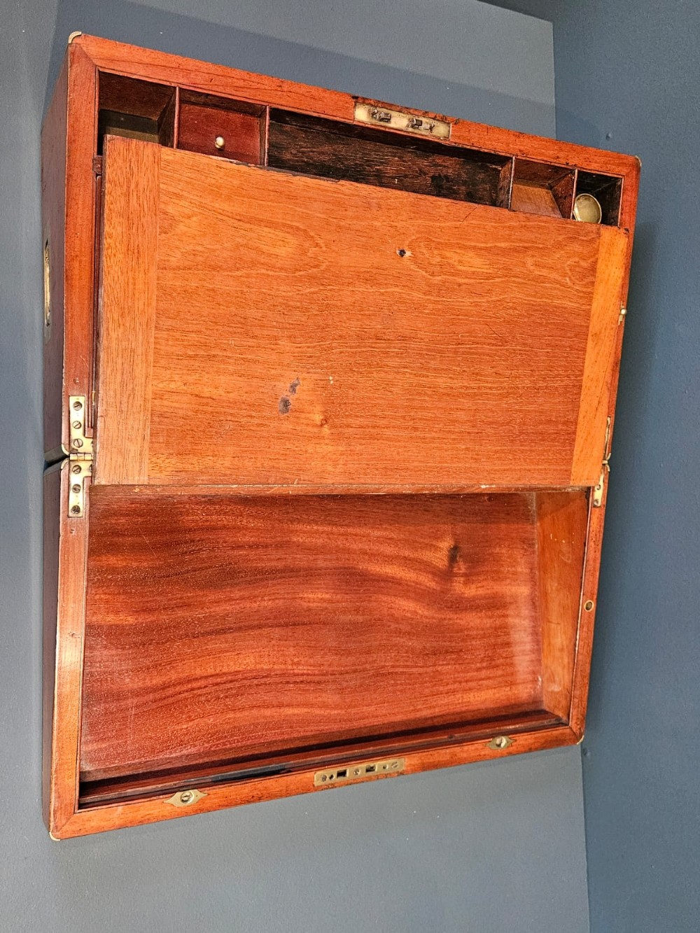 An open Victorian mahogany writing slope featuring a gold-tooled black leather insert, internal compartments, and an extended side drawer. View III