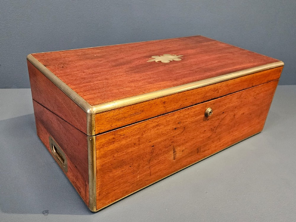 An open Victorian mahogany writing slope featuring a gold-tooled black leather insert, internal compartments, and an extended side drawer. View IV