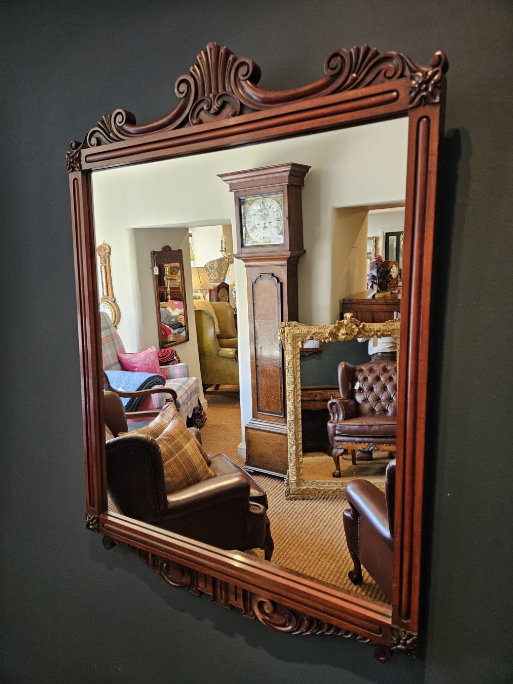 A rectangular Victorian mahogany wall mirror featuring a carved pediment crest and fluted side pillars. View III