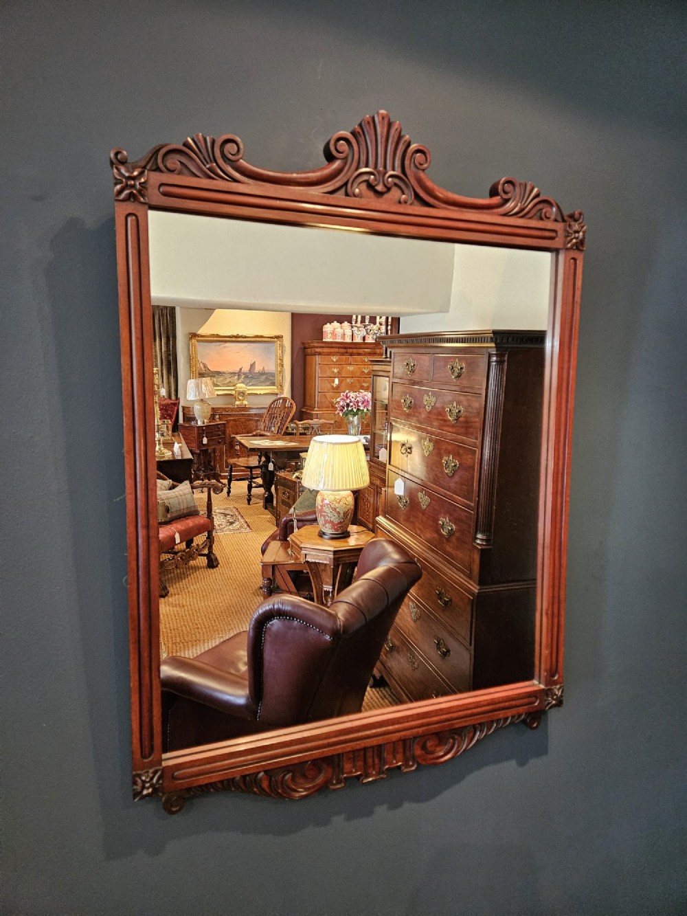 A rectangular Victorian mahogany wall mirror featuring a carved pediment crest and fluted side pillars. View IV