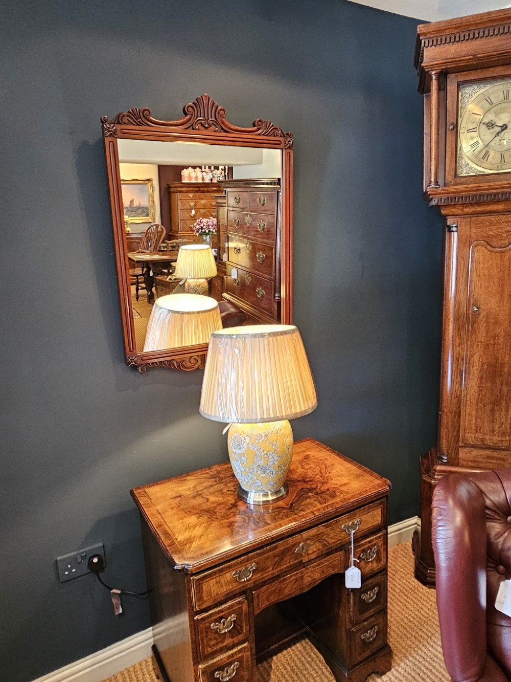 A rectangular Victorian mahogany wall mirror featuring a carved pediment crest and fluted side pillars. View VIII