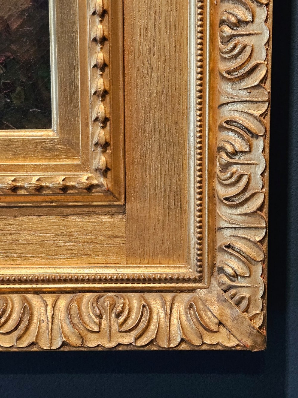 A Victorian oil painting on canvas depicting a profile view of an off-white Shorthorn bull standing in a green field, enclosed in a heavily moulded gilded frame. View VI