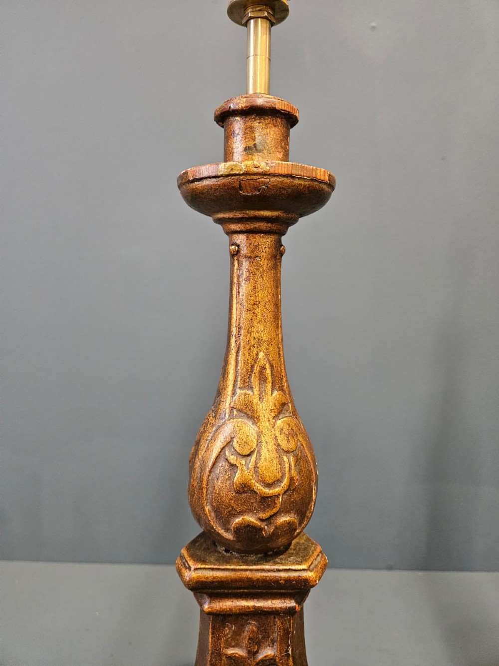 A pair of tall carved timber candlestick table lamps with aged gold gilding and scrolled bases. View VI