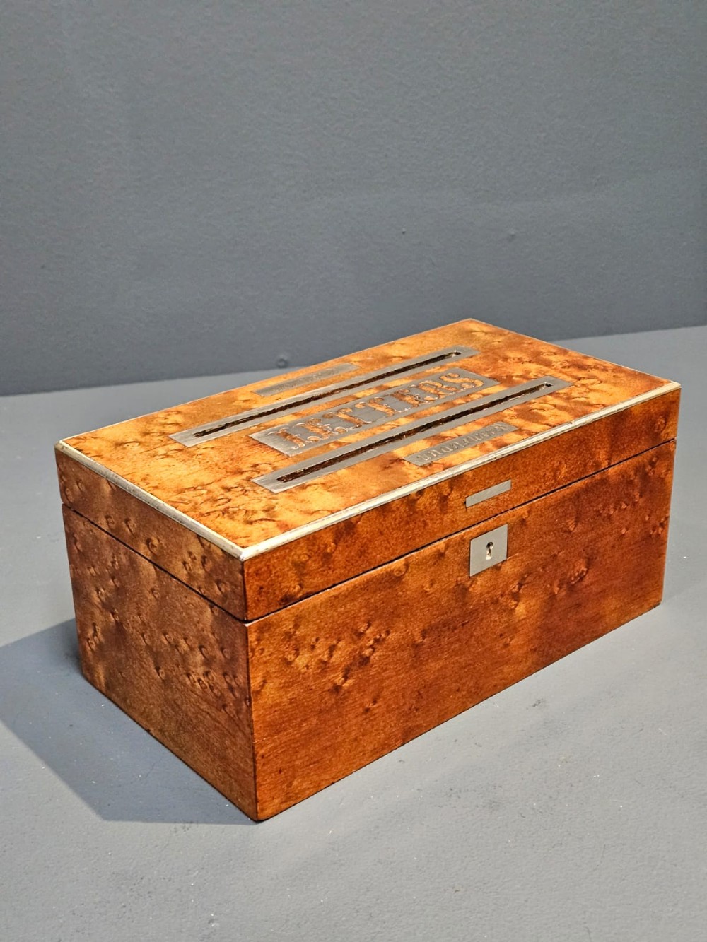 A Victorian burr satinwood desktop post box featuring slotted metal plates labelled letters, answered, and unanswered. View V