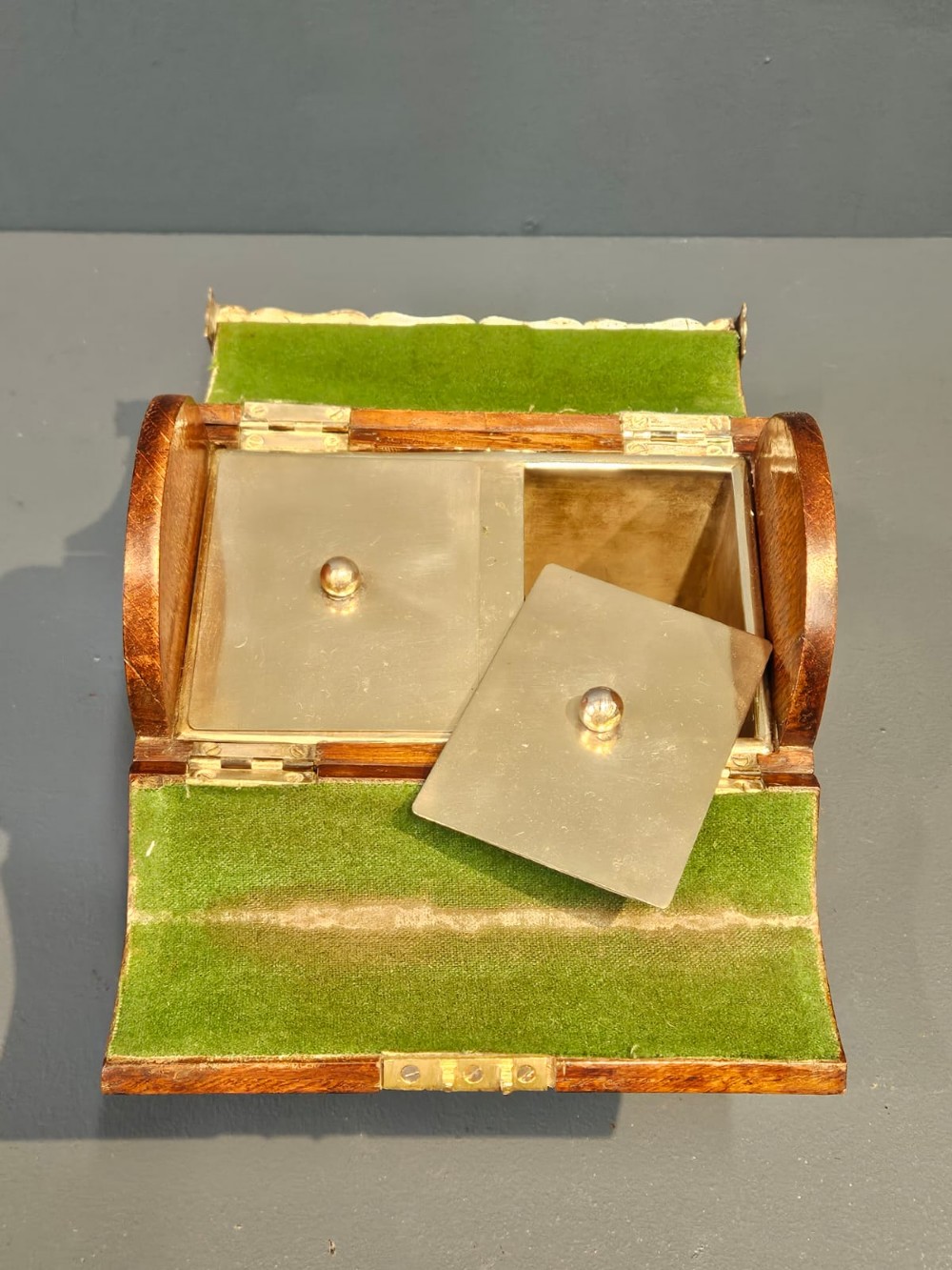 A Victorian domed oak tea caddy featuring silver-plated corner mounts, an escutcheon, and side carrying handles. View IV
