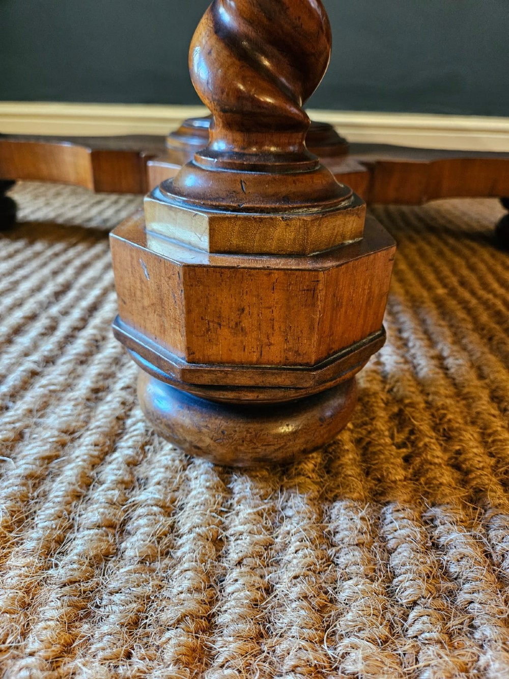 An octagonal burr walnut low coffee table featuring light wood stringing inlay, four barley twist support legs, and a central turned column on a quadruped base. View VIII
