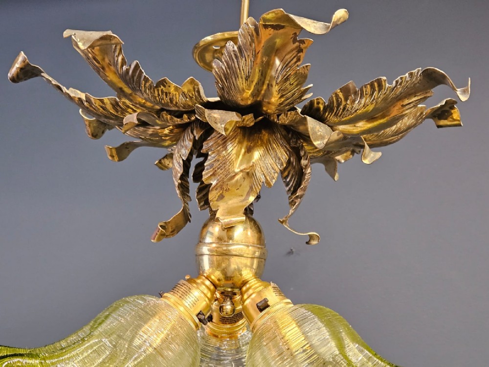 Victorian ceiling light featuring cast brass leaf motifs around the ceiling mount above fluted green glass shades. View V