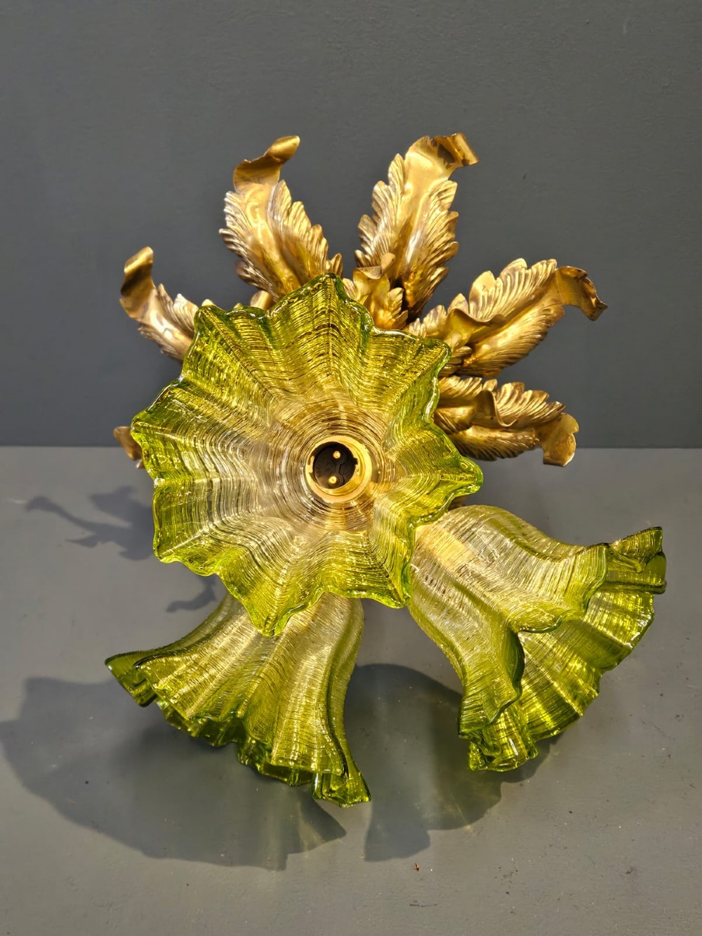 Victorian ceiling light featuring cast brass leaf motifs around the ceiling mount above fluted green glass shades. View IX