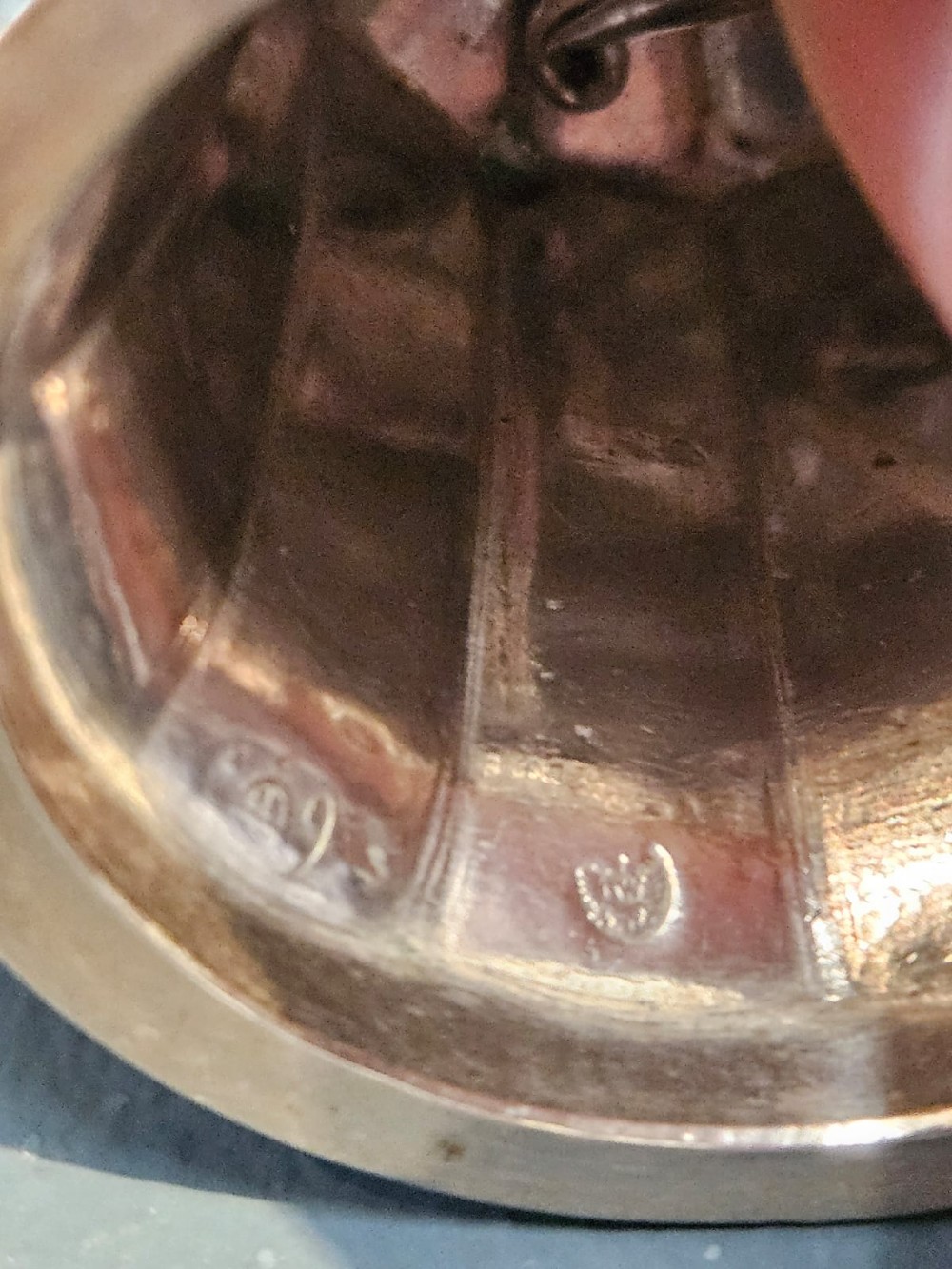 A Victorian silver table bell featuring a fruit basket finial, dual handles, a faceted body, and an embossed rim. View IV