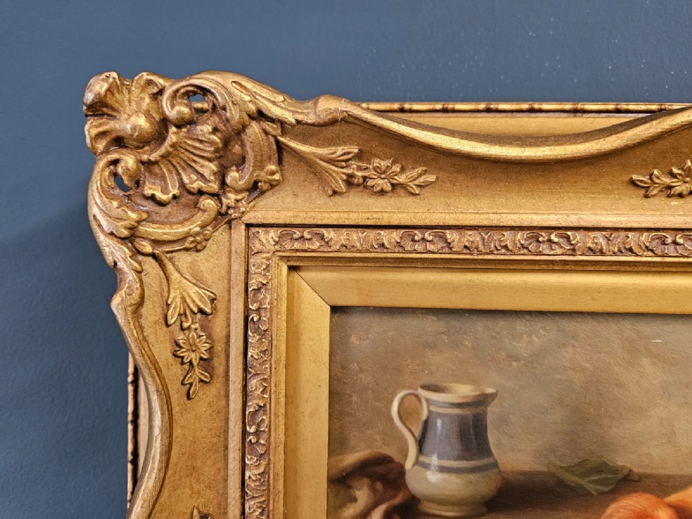 An oil painting on canvas depicting a cockerel and two hens inside a rustic barn beside a wicker basket and cabbage, enclosed in a heavily carved gold frame. View VI