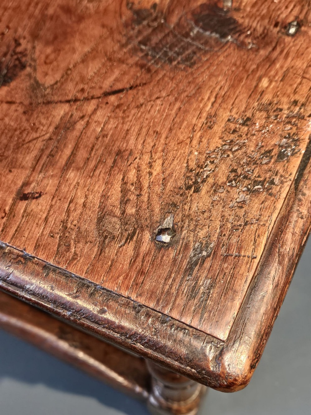 A George III oak joint stool featuring turned legs, lower stretchers, and a moulded rectangular top. View III