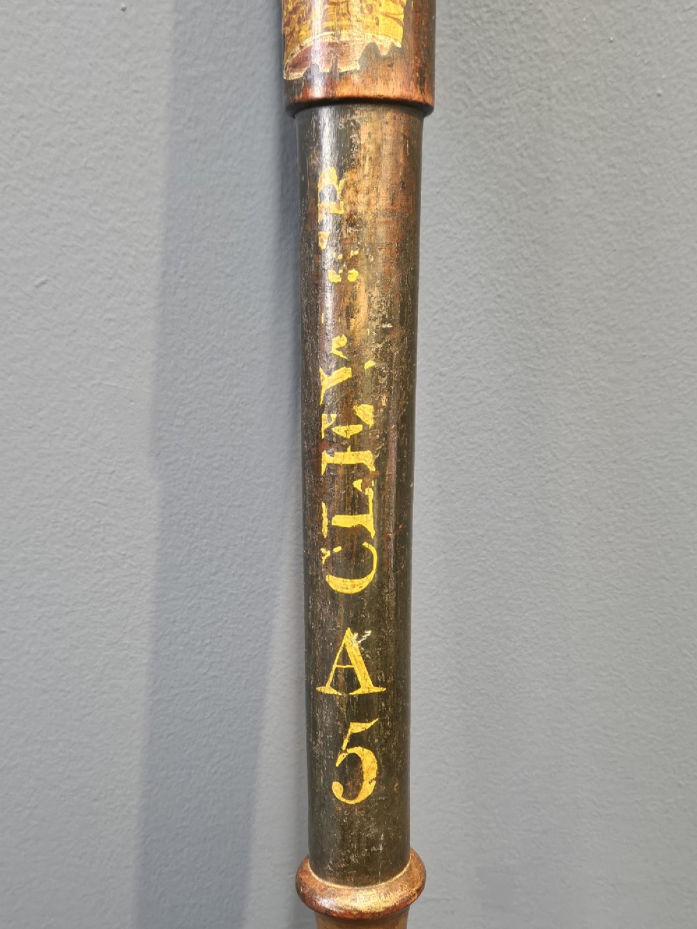 A turned dark hardwood police truncheon with hand-painted WR IV royal insignia, a crown, parish lettering reading CLEAVER A5, and a ribbed handle with a wrist strap hole. View VI