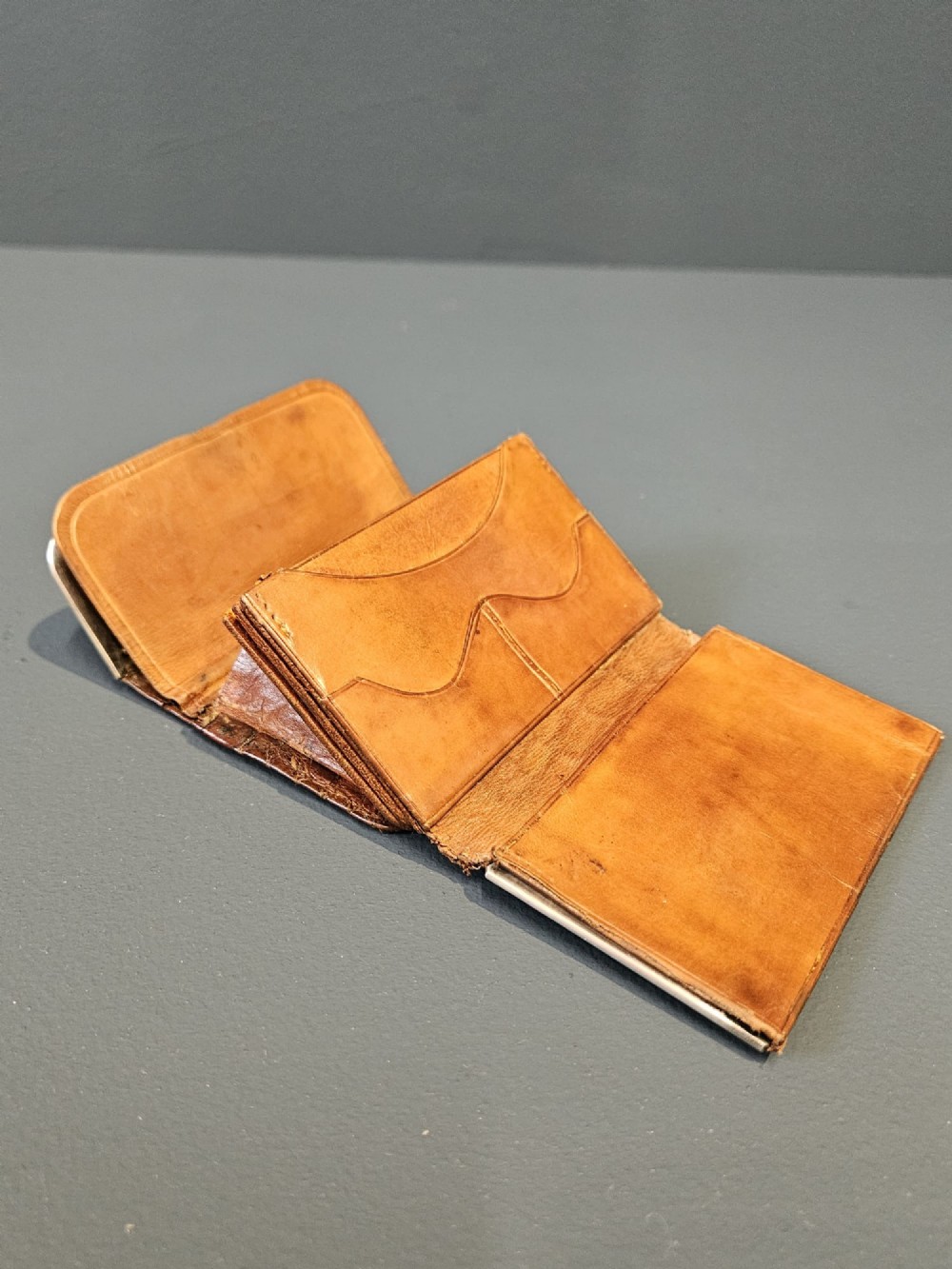 A small rectangular brown crocodile skin purse with hallmarked sterling silver rim mounts and a central push-button clasp. View III