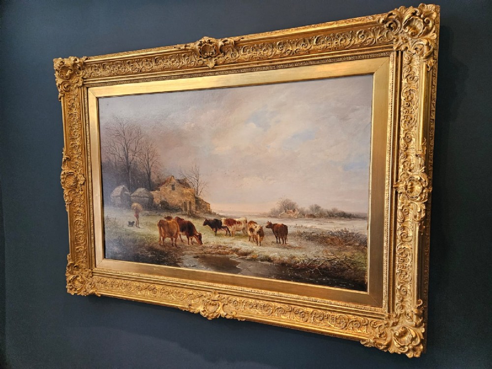 A 19th-century Victorian oil painting on canvas depicting a rural winter pastoral scene with cattle, set within an ornate gold gilt frame. View VI