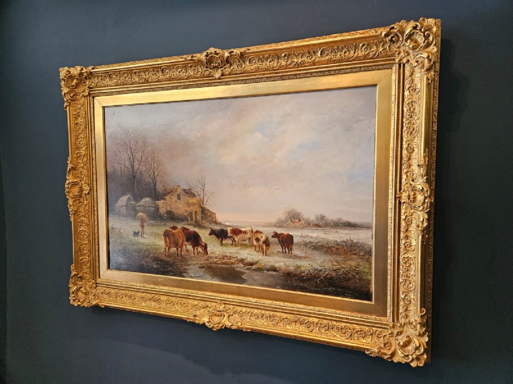 A 19th-century Victorian oil painting on canvas depicting a rural winter pastoral scene with cattle, set within an ornate gold gilt frame. View IX