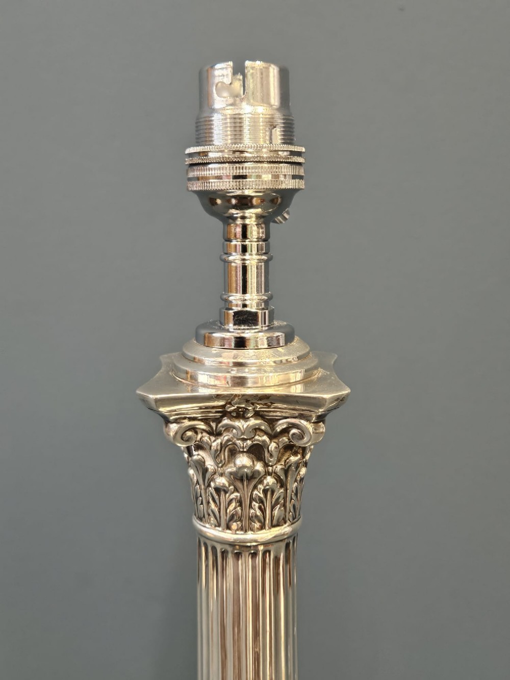 A Victorian silver Corinthian column table lamp with an acanthus leaf capital, fluted shaft, and engraved stepped base. View III