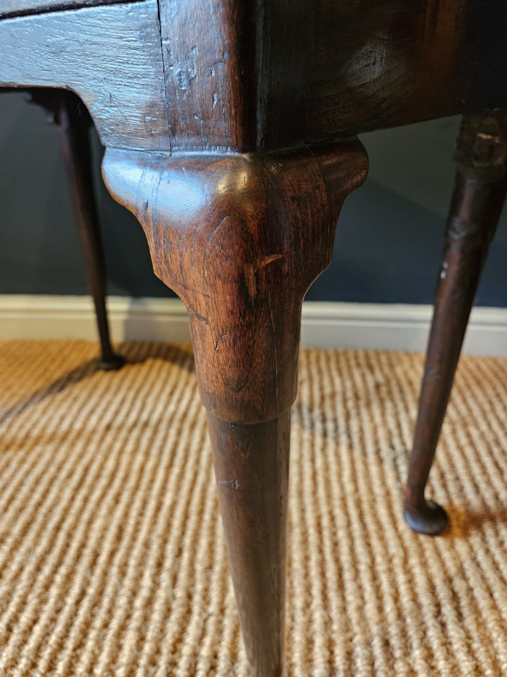 A George II dark oak side table with a single drawer, pierced brass handles, a shaped apron, and four cabriole legs terminating in pad feet. View VIII