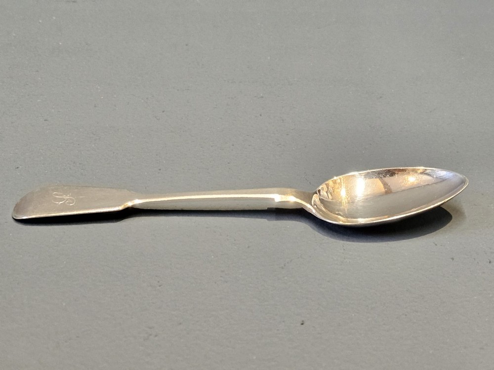 A set of six Victorian sterling silver teaspoons featuring engraved monograms on the handles. View V