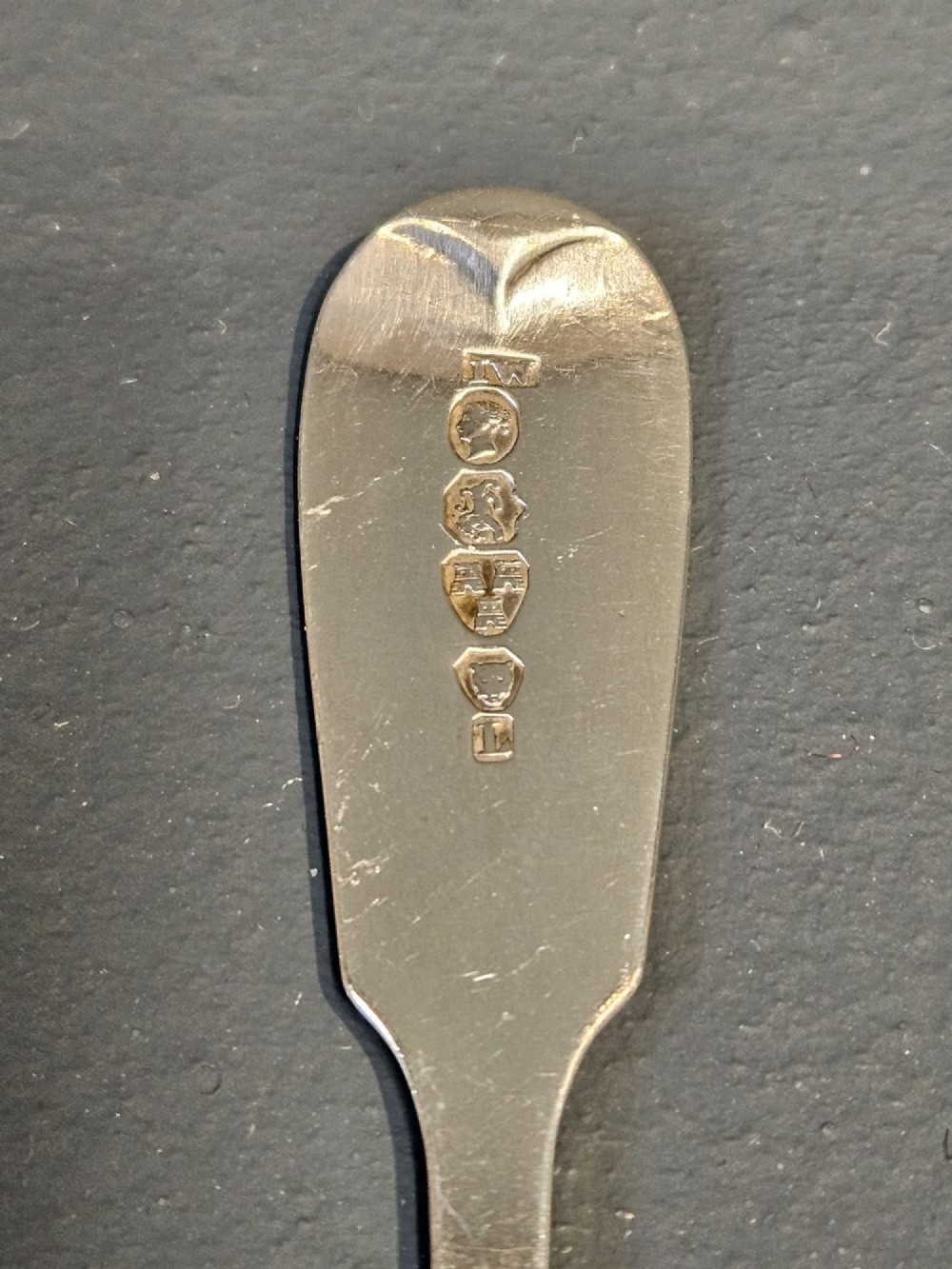 A set of six Victorian sterling silver teaspoons featuring engraved monograms on the handles. View VI