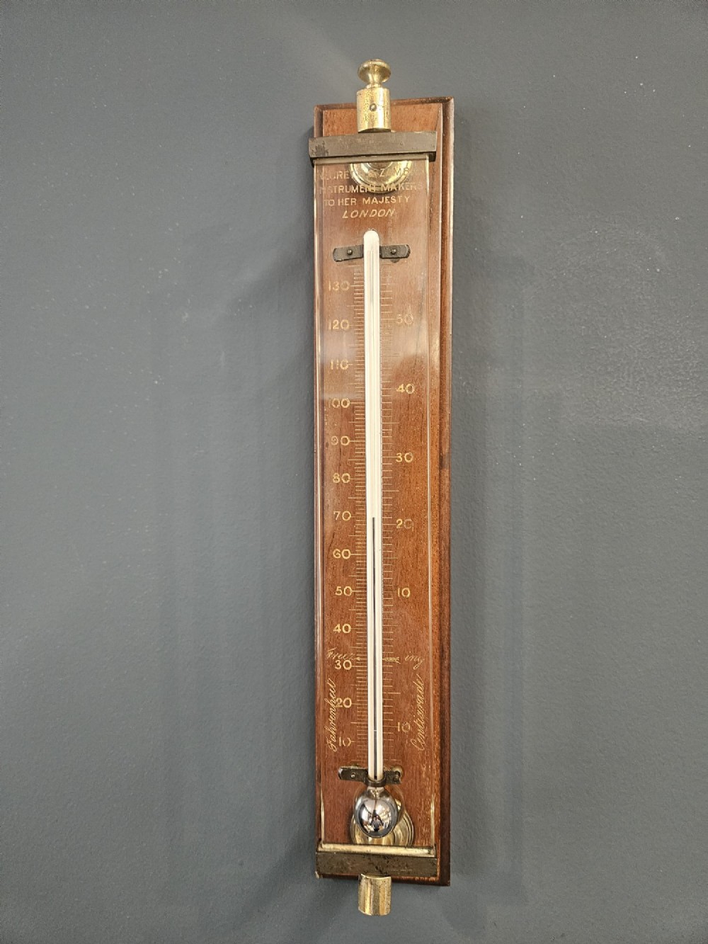 Victorian mahogany and brass wall thermometer with engraved Fahrenheit and Centigrade scales by Negretti and Zambra. View II