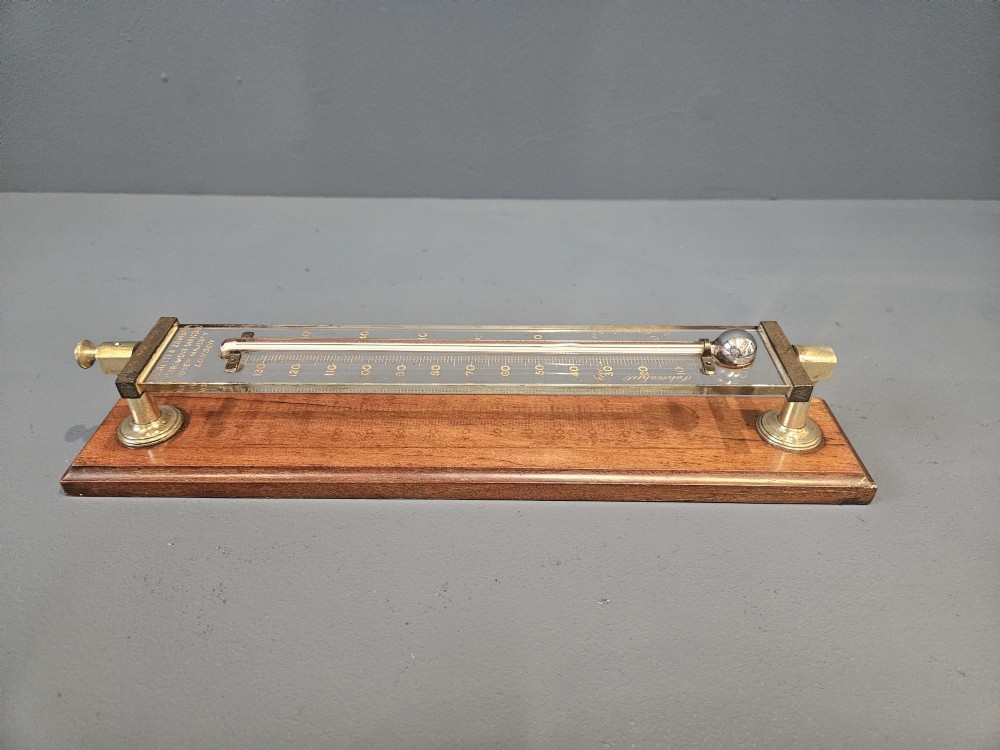 Victorian mahogany and brass wall thermometer with engraved Fahrenheit and Centigrade scales by Negretti and Zambra. View V