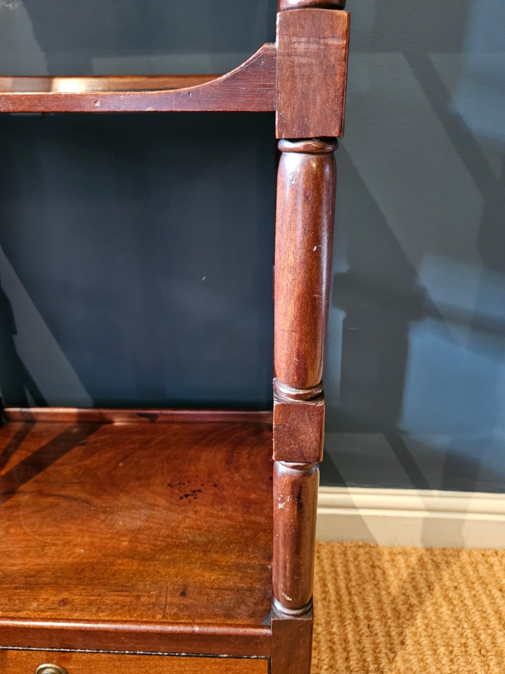 A tall Regency four-tier mahogany whatnot stand with slender turned posts, finial top ornaments, open shelves, and a base drawer. View III