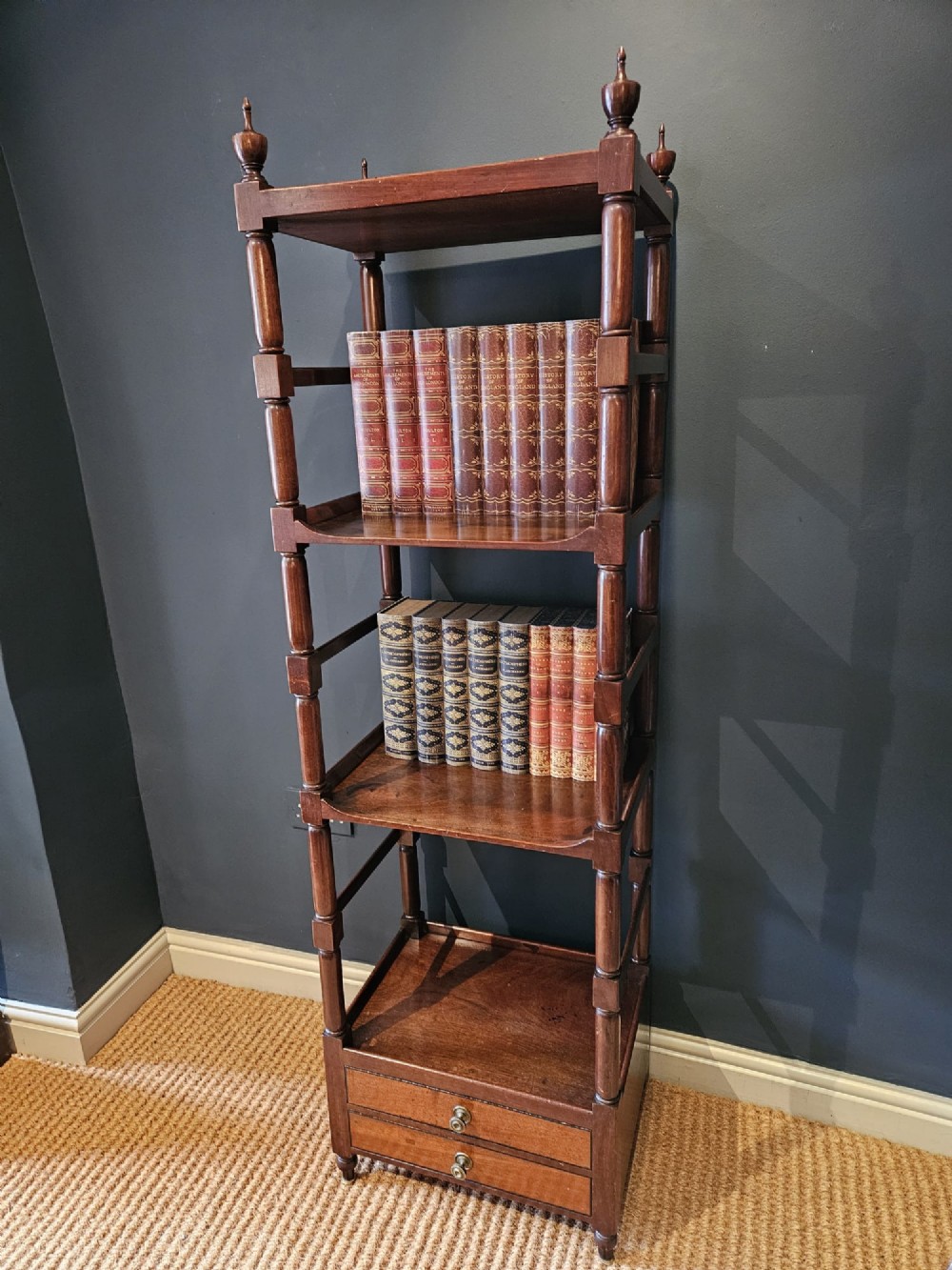 A tall Regency four-tier mahogany whatnot stand with slender turned posts, finial top ornaments, open shelves, and a base drawer. View XIII