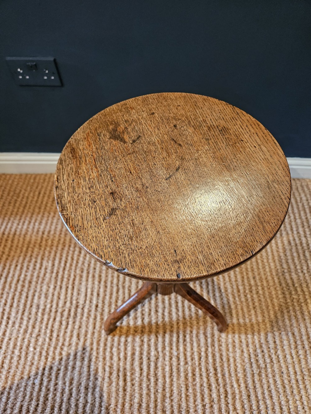 A Regency oak candle table with a circular top, a turned central pedestal stem, and three splayed tripod legs. View V