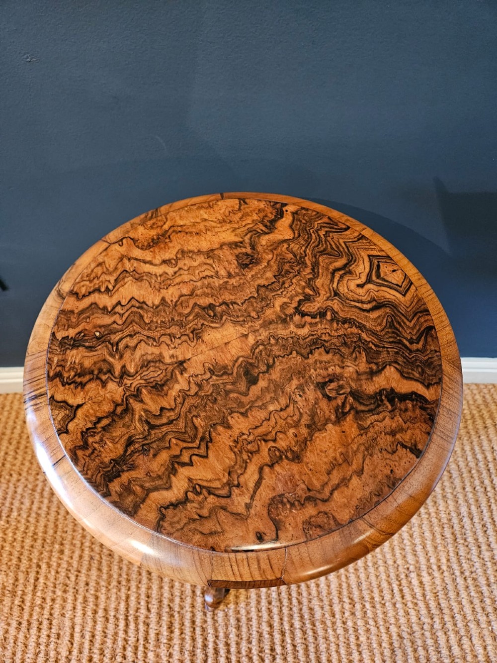 An early Victorian circular burr walnut work table featuring a spiral-turned column, beaded rim moulding, and a tripod cabriole base. View IV