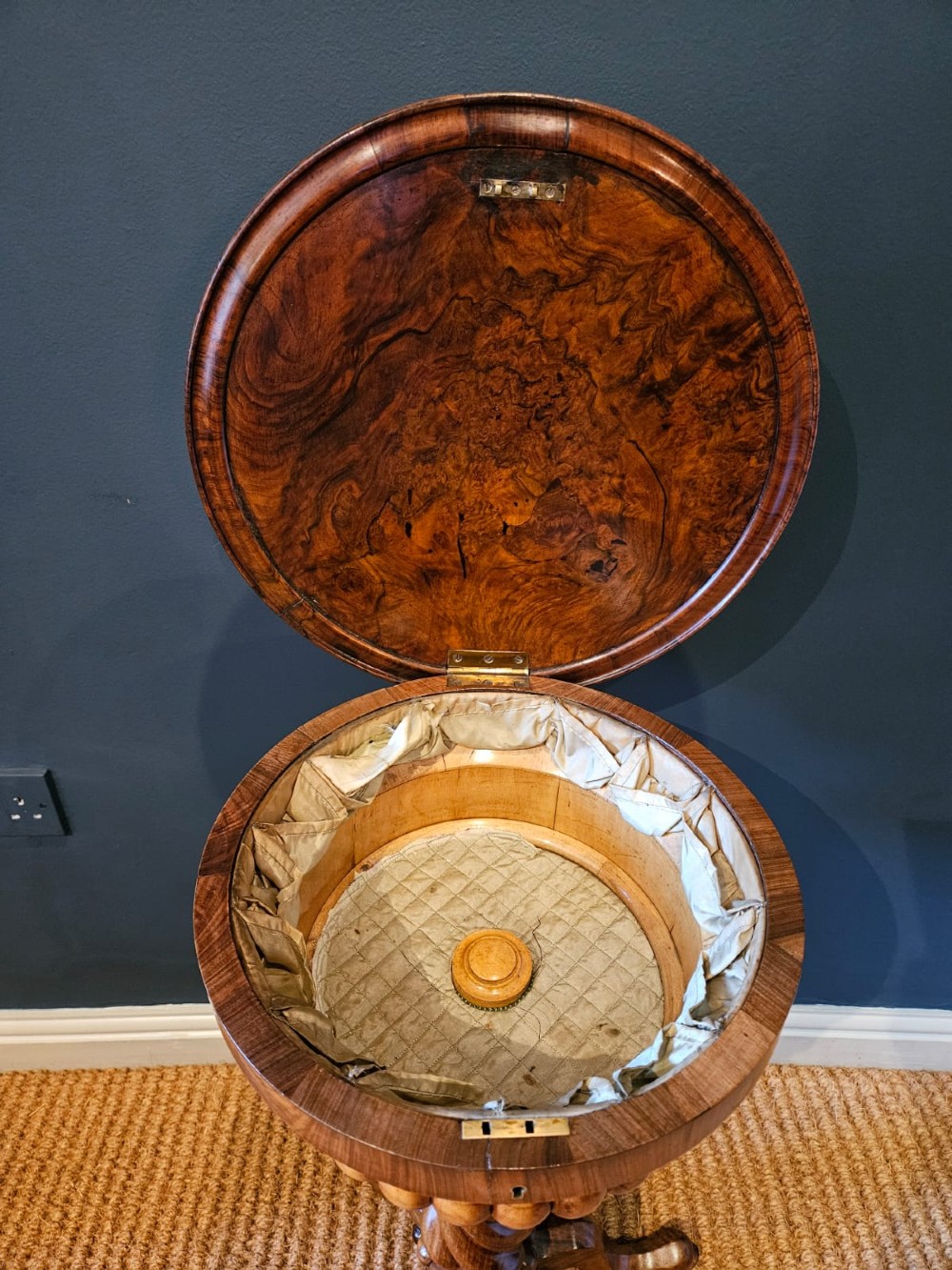 An early Victorian circular burr walnut work table featuring a spiral-turned column, beaded rim moulding, and a tripod cabriole base. View V