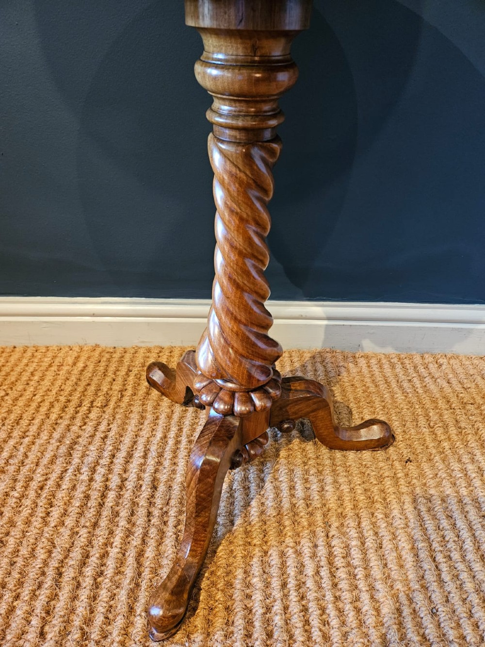 An early Victorian circular burr walnut work table featuring a spiral-turned column, beaded rim moulding, and a tripod cabriole base. View VI