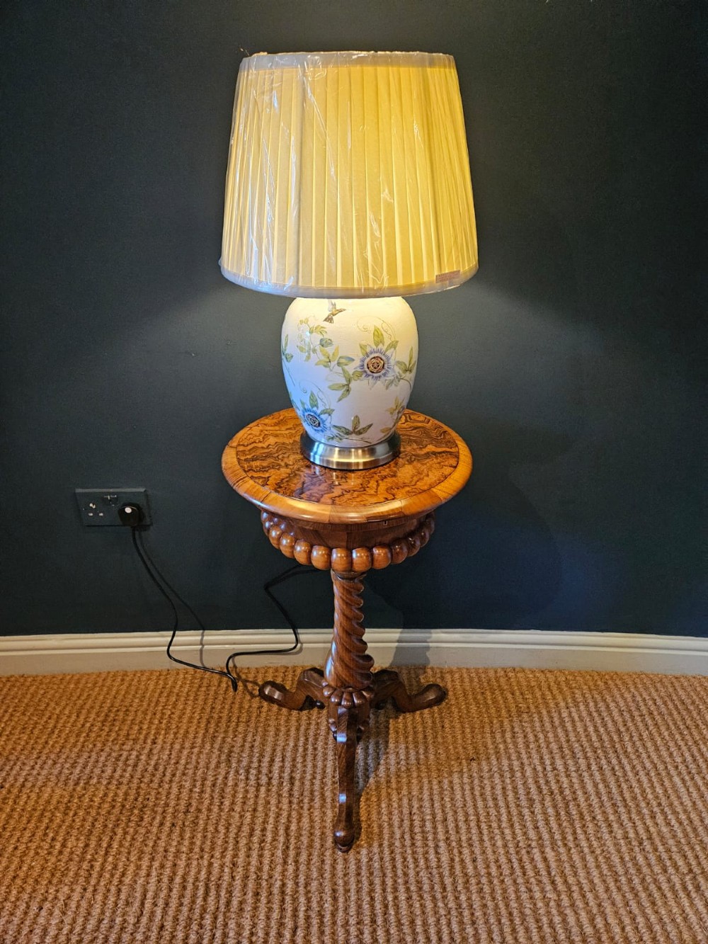An early Victorian circular burr walnut work table featuring a spiral-turned column, beaded rim moulding, and a tripod cabriole base. View VII