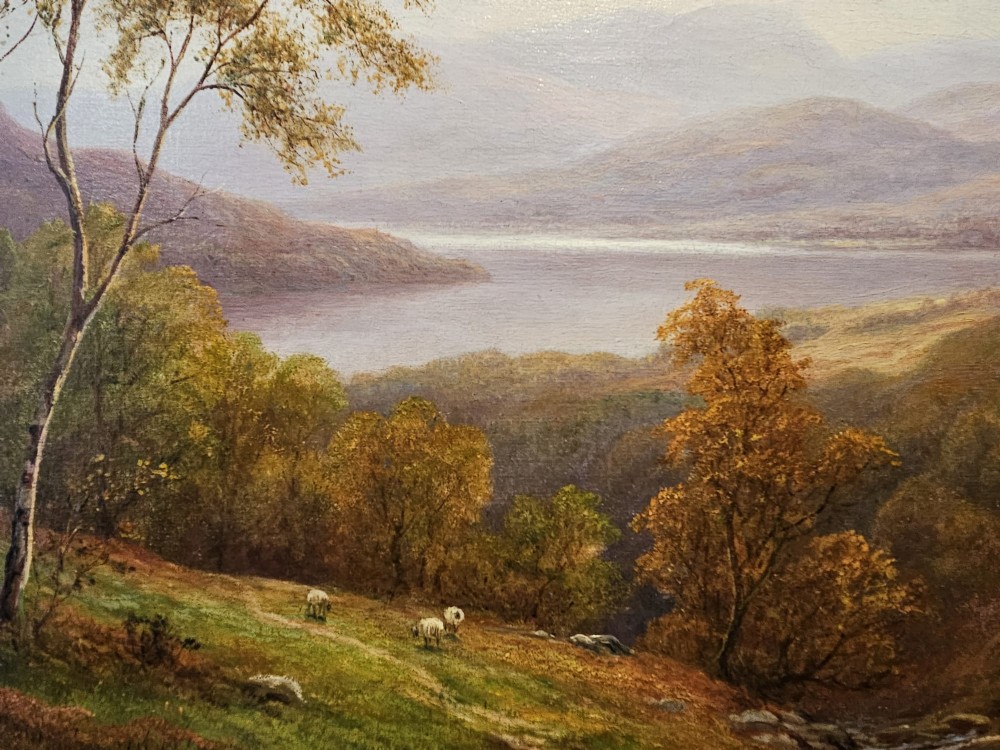 A Victorian landscape oil painting depicting a Lake District scene with hills and trees, enclosed in an ornate gold gilt frame. View VII