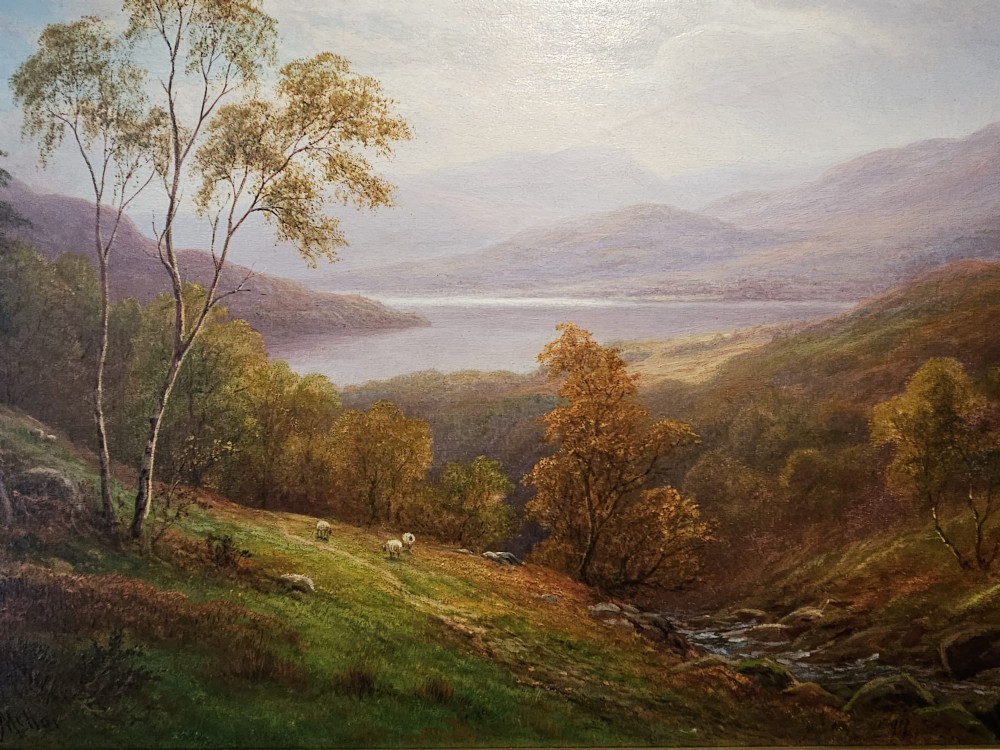 A Victorian landscape oil painting depicting a Lake District scene with hills and trees, enclosed in an ornate gold gilt frame. View IX