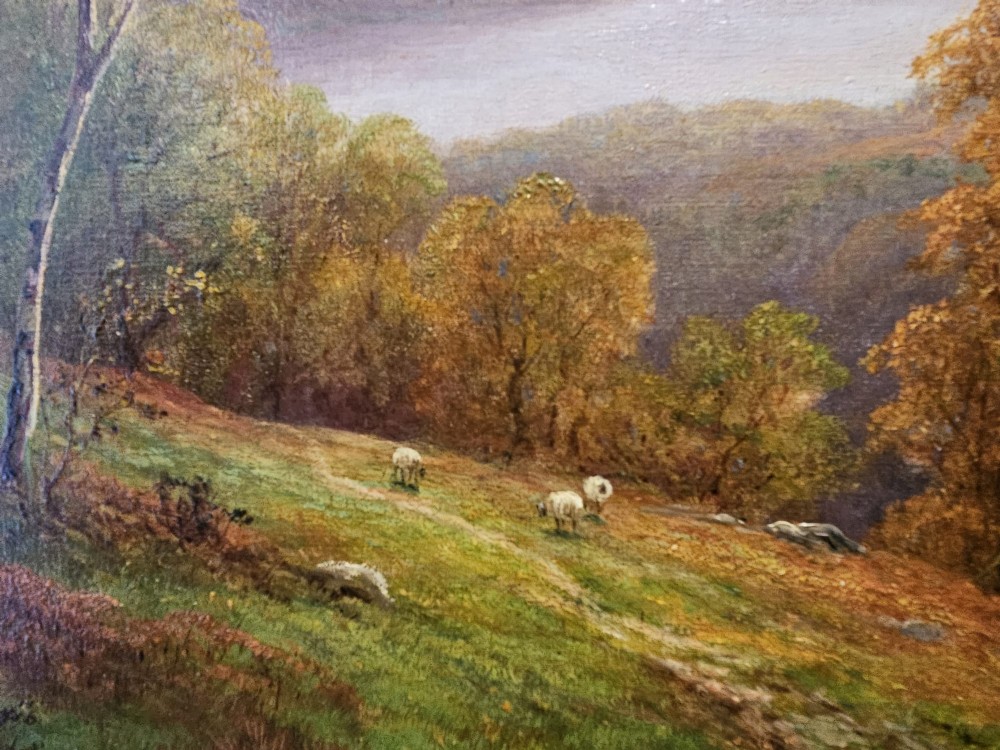 A Victorian landscape oil painting depicting a Lake District scene with hills and trees, enclosed in an ornate gold gilt frame. View X